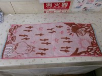 ①　タオル